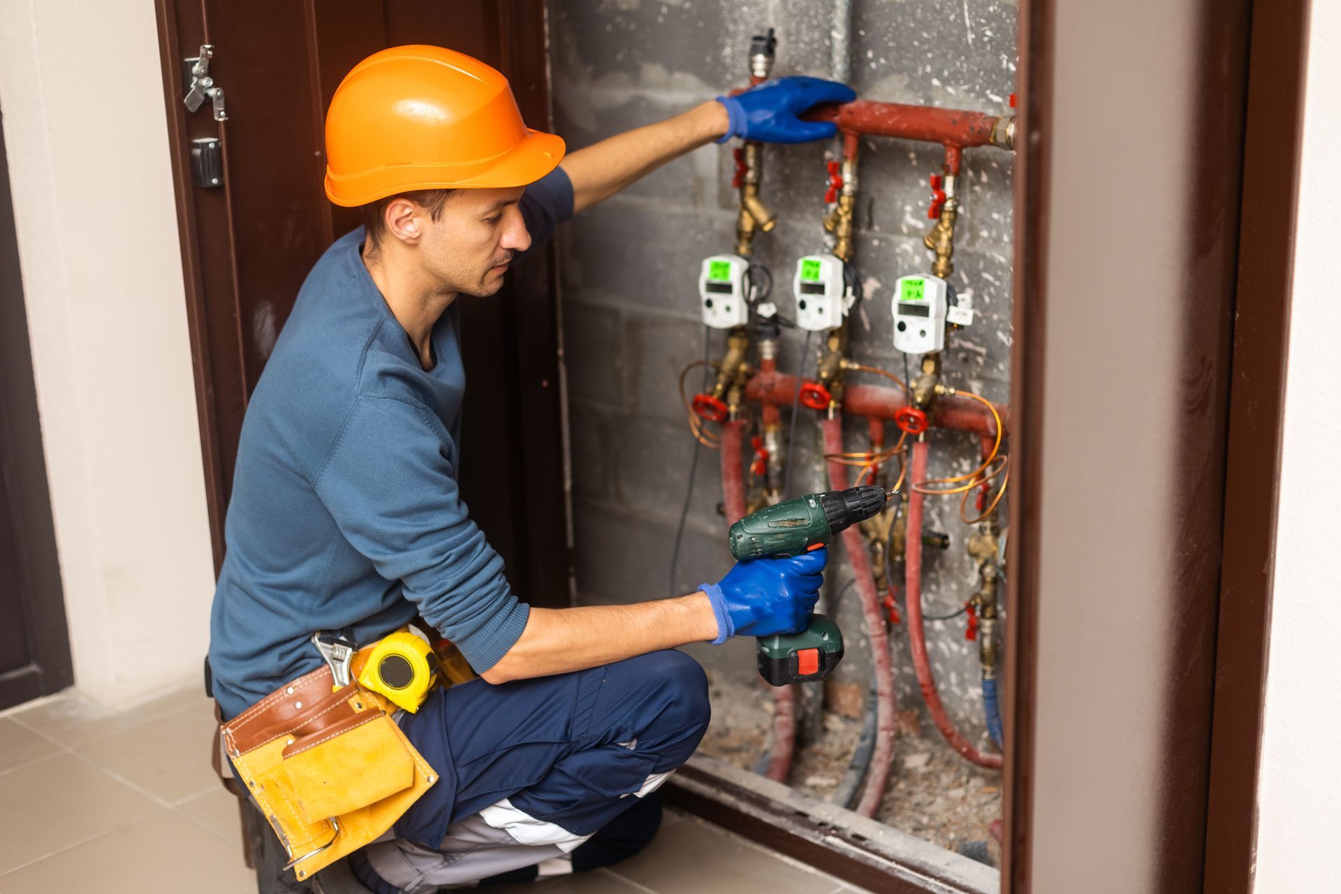 Commercial plumbing technician servicing pipes for a Minneapolis, MN business Commercial plumbing technician servicing pipes for a Minneapolis, MN business