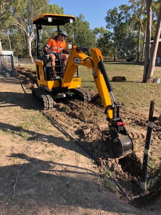 Parked Backhoe on Residential Job Site — Earthworks in Rockhampton QLD