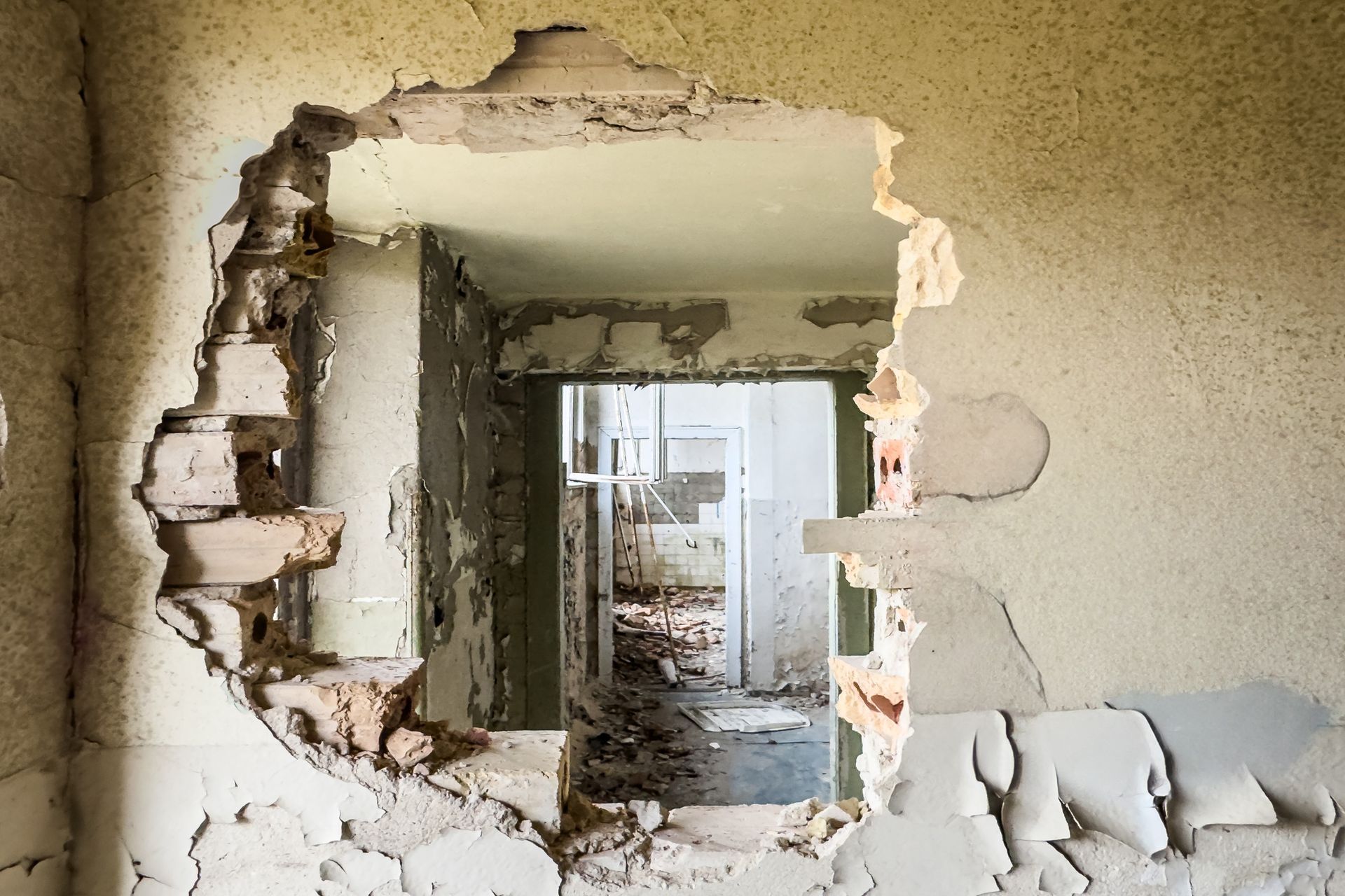 There is a hole in the wall in the middle of the room.