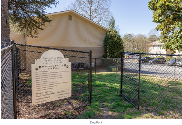 A dog park is behind a chain link fence