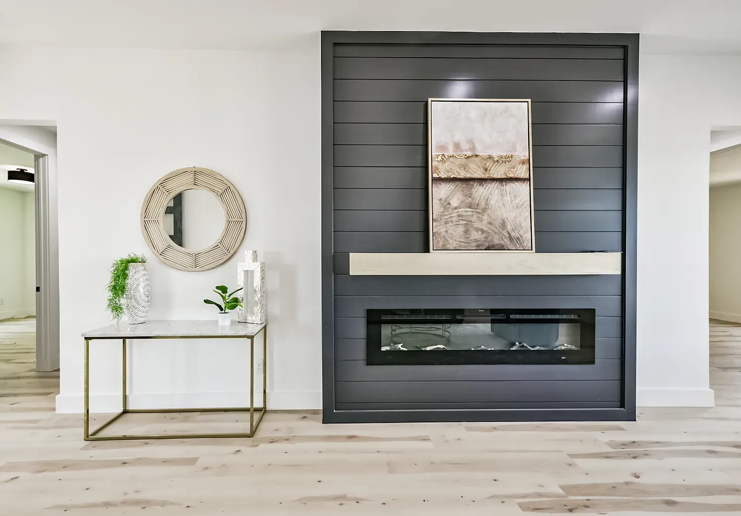 A living room with a fireplace and a table