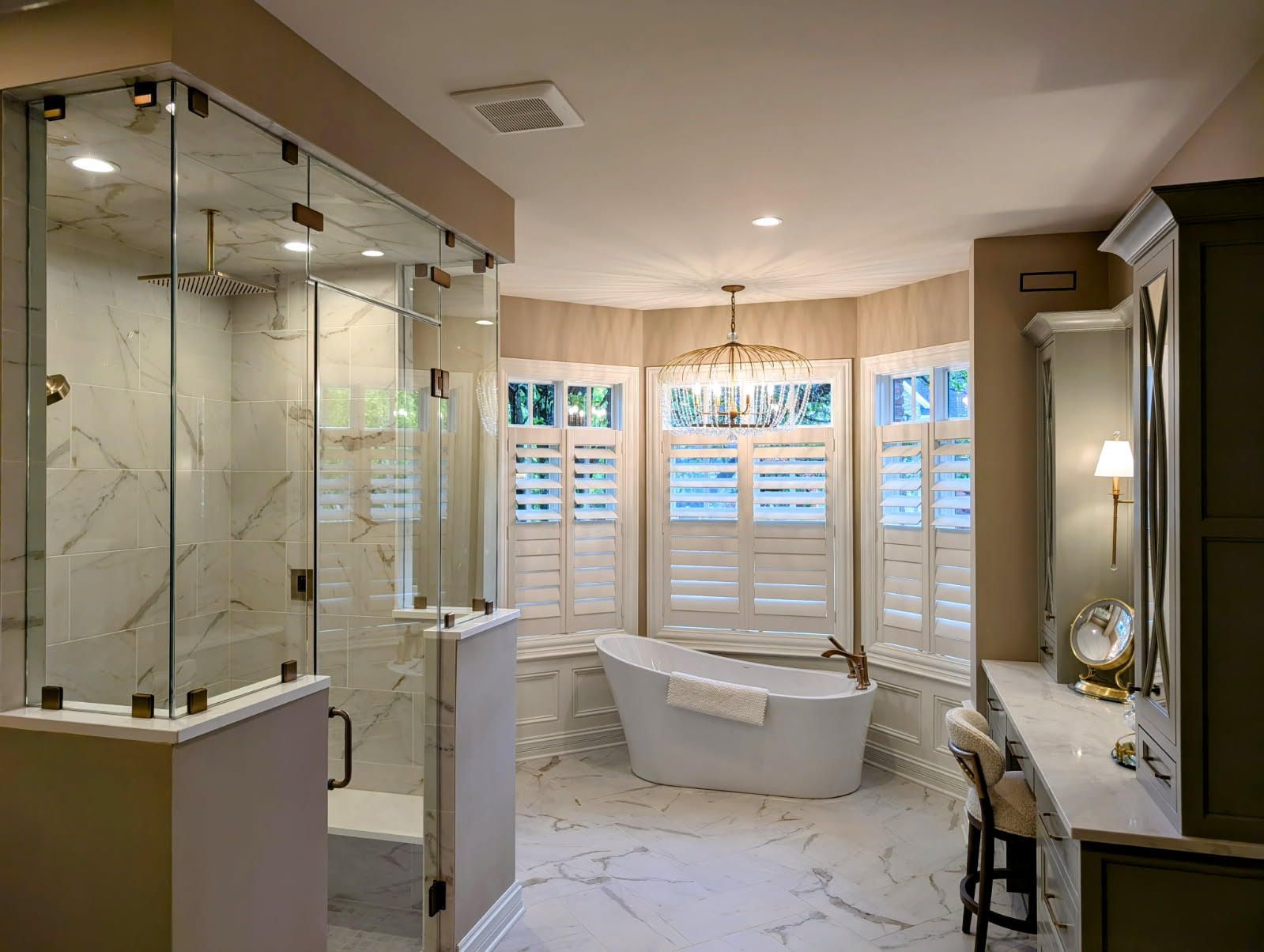 Modern bathroom with a double-sink gray vanity, white marble-tiled shower, and two rectangular mirrors on a white wall.
