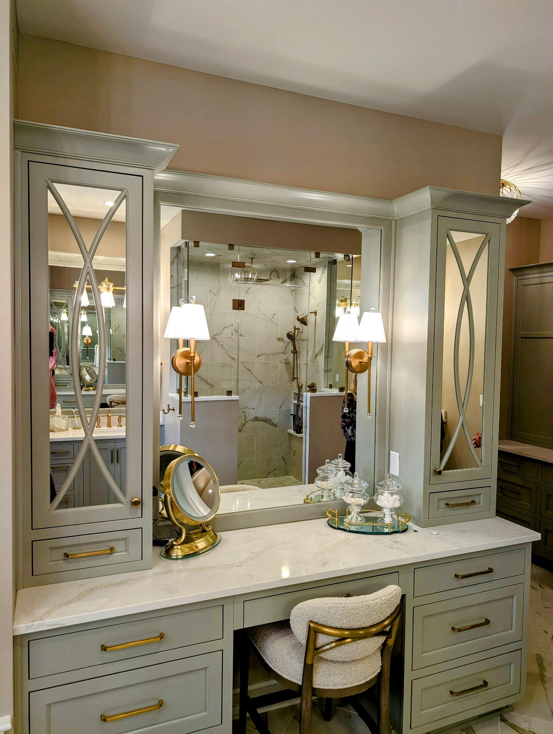 A modern farmhouse kitchen with vaulted ceilings, wooden beams, a central island, and a brick backsplash.
