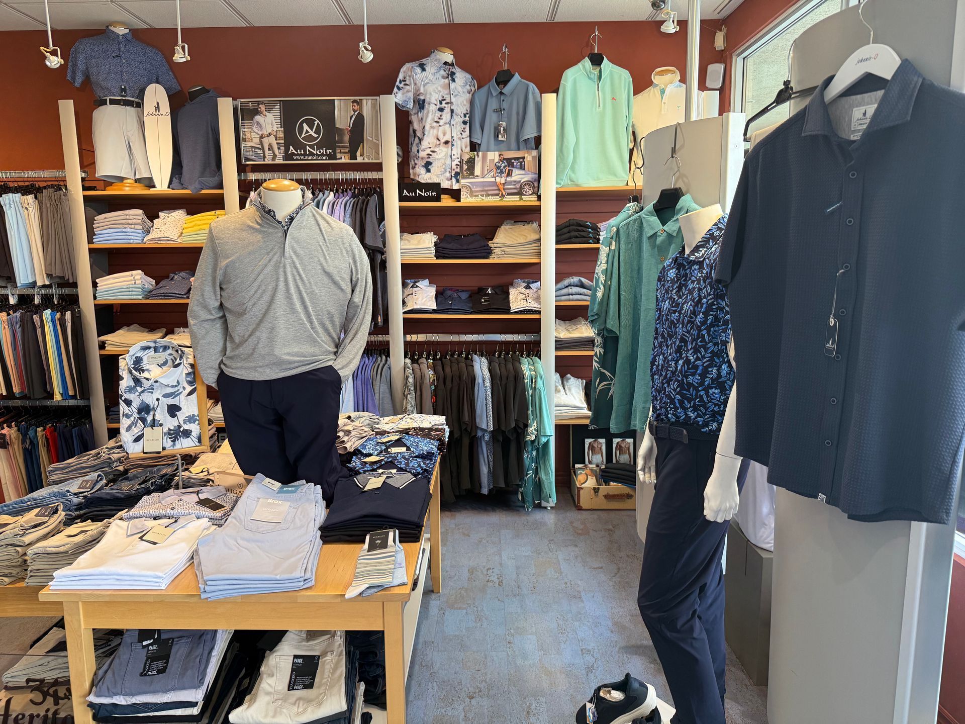 Interior of At Ease Men’s Apparel in Windsor featuring coordinated men’s shirts, jackets, pants, and accessories