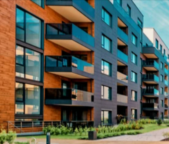 a row of multi - story apartment buildings with balconies