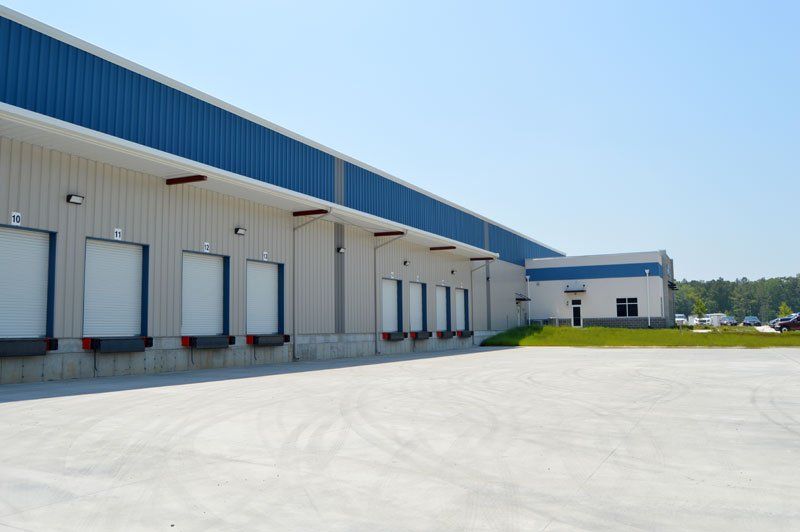 a large warehouse with a lot of loading doors