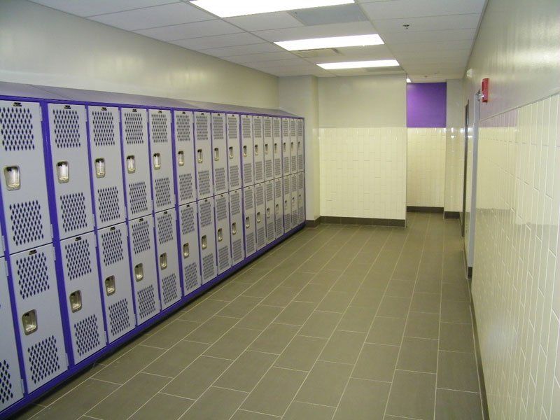 a row of purple lockers in a hallway
