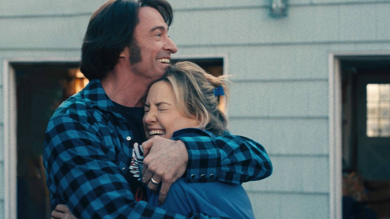 An image of a man and a woman hugging,