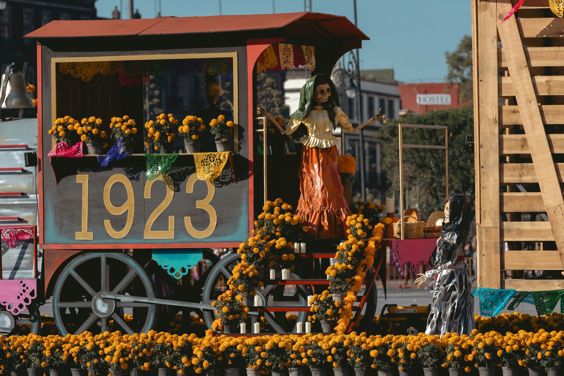 A photo of a caravan and a skeleton and flowers. 