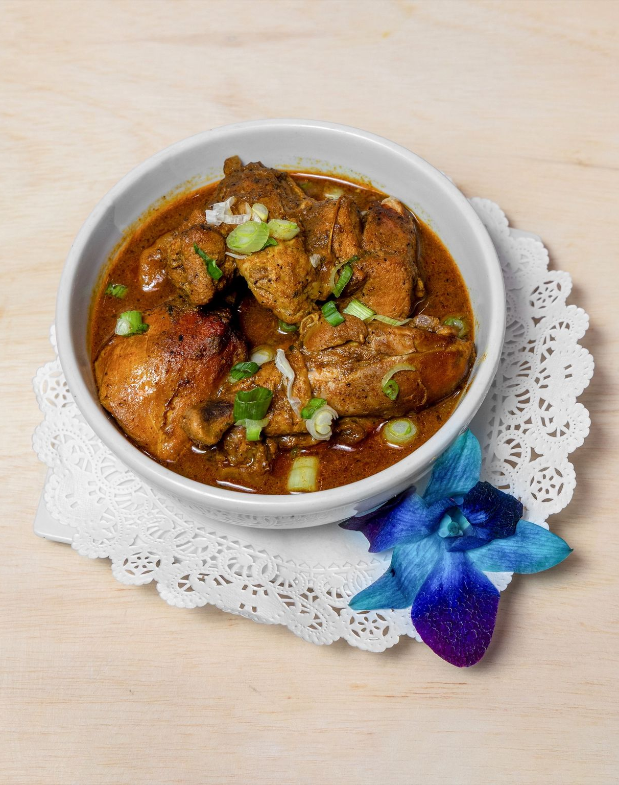 A close up of a sliced mango on a table.
