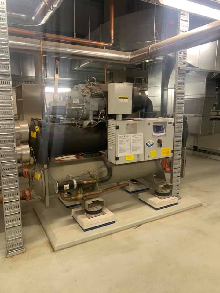 Large Industrial Chiller Unit in An Equipment Room — Leader Air Conditioning in Queanbeyan, NSW