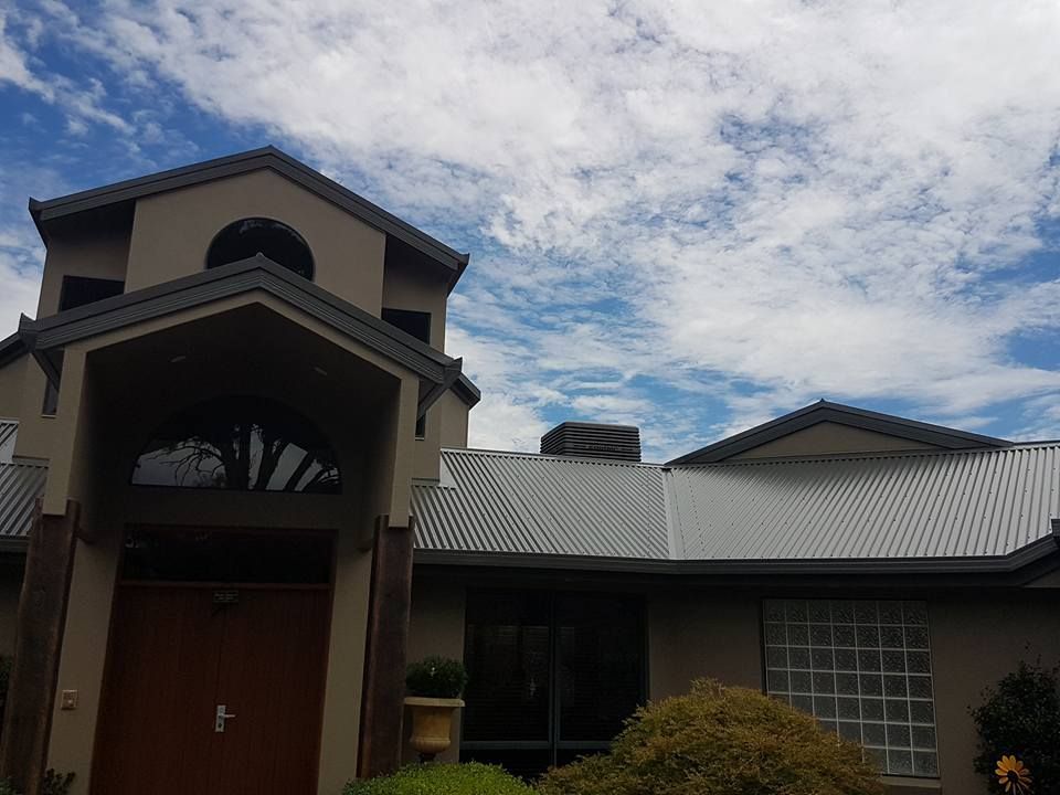 House with Grey Corrugated Metal Roof — Leader Air Conditioning in Queanbeyan, NSW