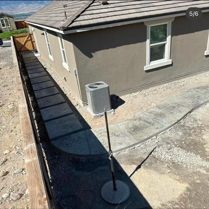 A picture of a house with a walkway leading to it