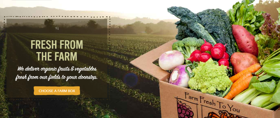 A box filled with vegetables is on a website that says fresh from the farm.