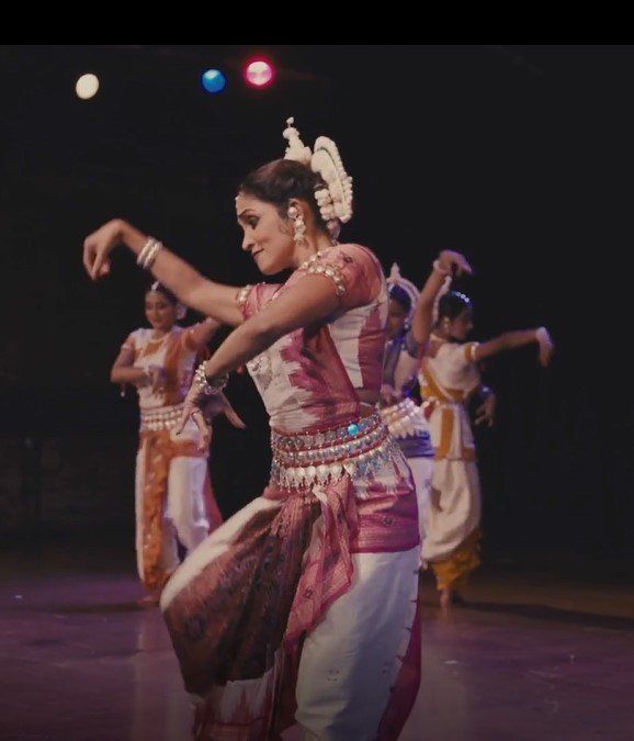 A group of women are dancing on a stage