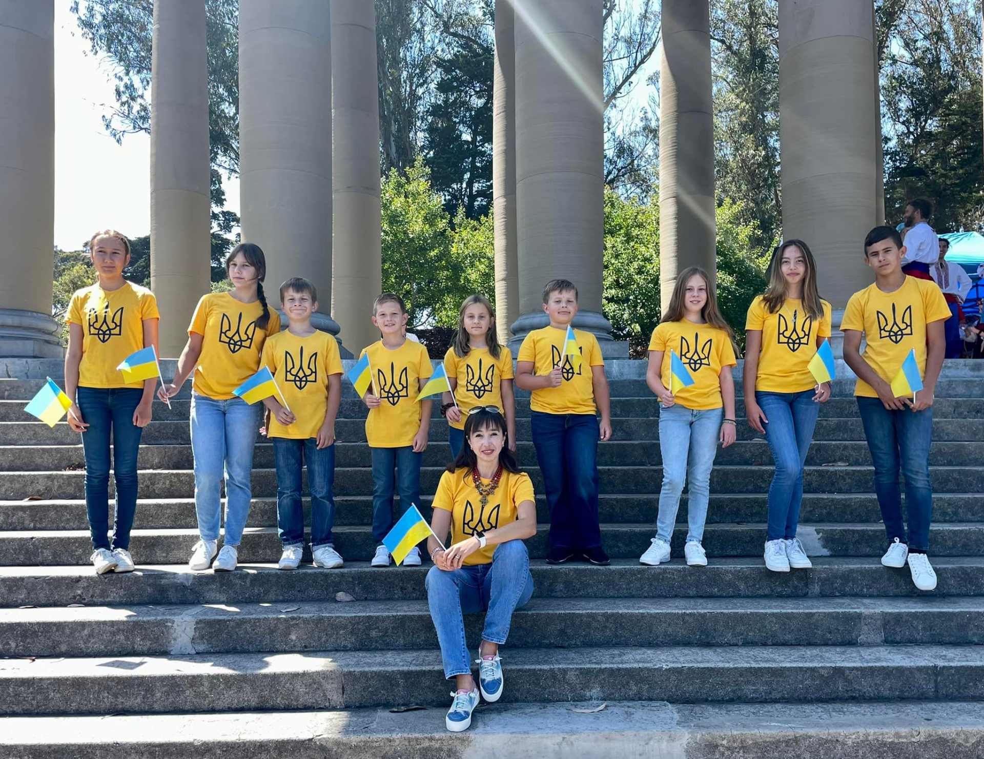 A group of children wearing yellow shirts with the word ukraine on them