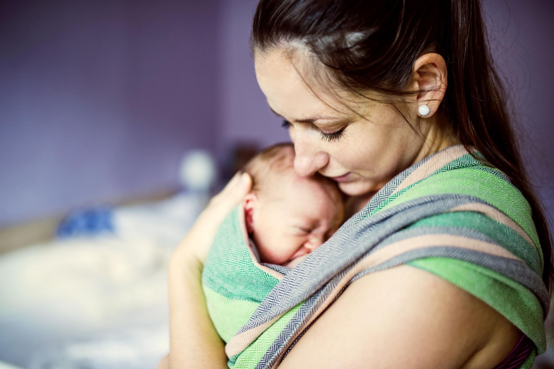 A Woman Is Holding A Baby - Stuart, FL - Karen Johnson Law