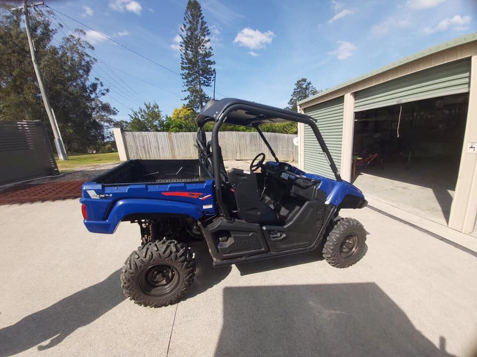 A Blue Atv Is Parked In Front Of A Garage — Mudgeeraba Auto Electrical & Mechanical In Mudgeeraba, QLD