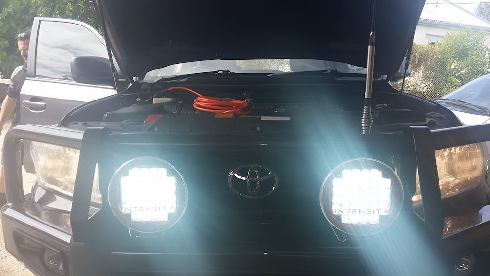 The Hood Of A Toyota Truck Is Open And The Lights Are On — Mudgeeraba Auto Electrical & Mechanical In Mudgeeraba, QLD