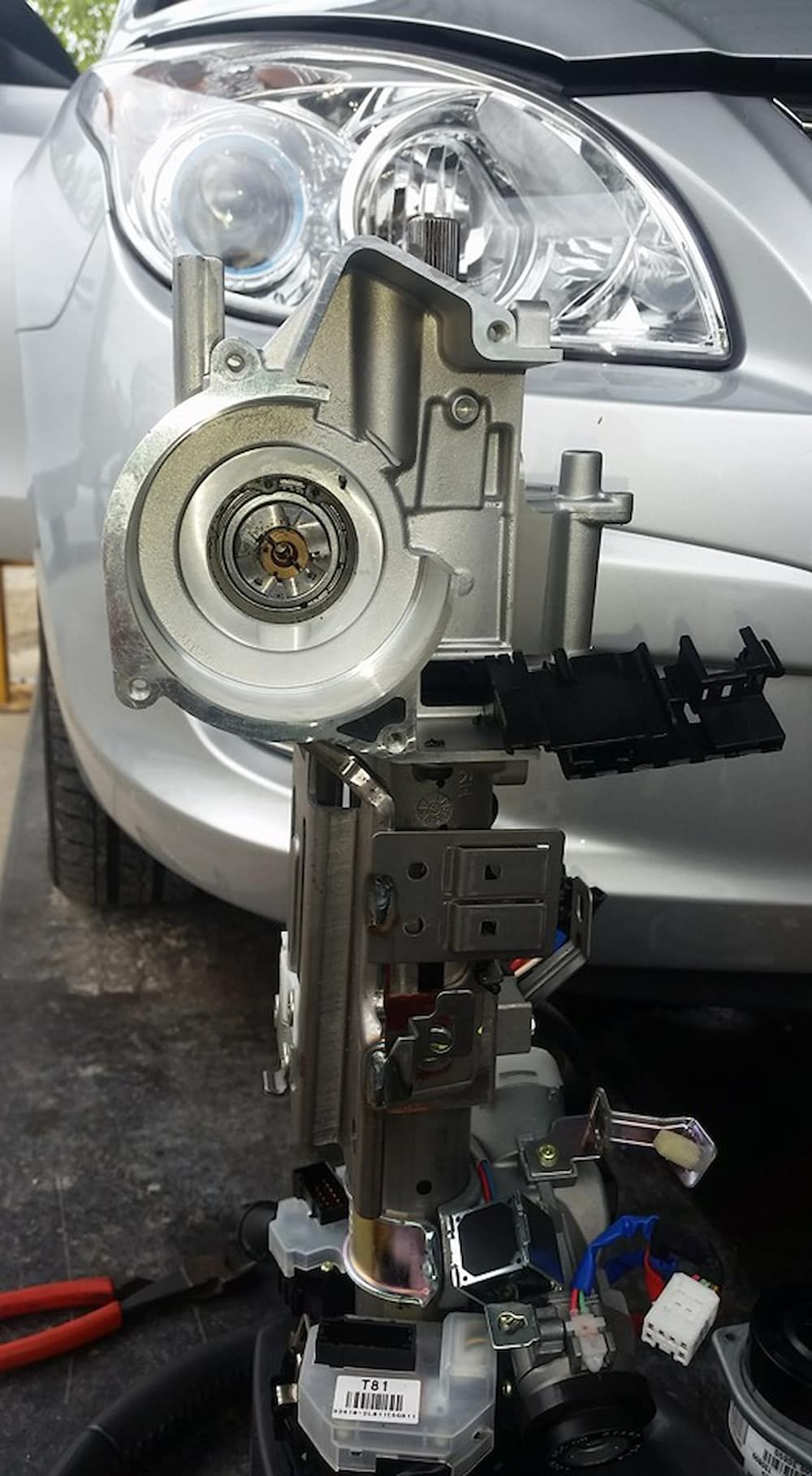 A Steering Wheel Is Being Removed From A Silver Car — Mudgeeraba Auto Electrical & Mechanical In Mudgeeraba, QLD