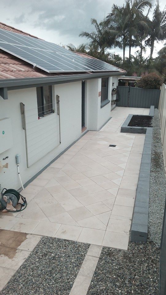 A House With a Patio and Solar Panels on the Roof — Seascapes Landscape Construction in Kendall, NSW