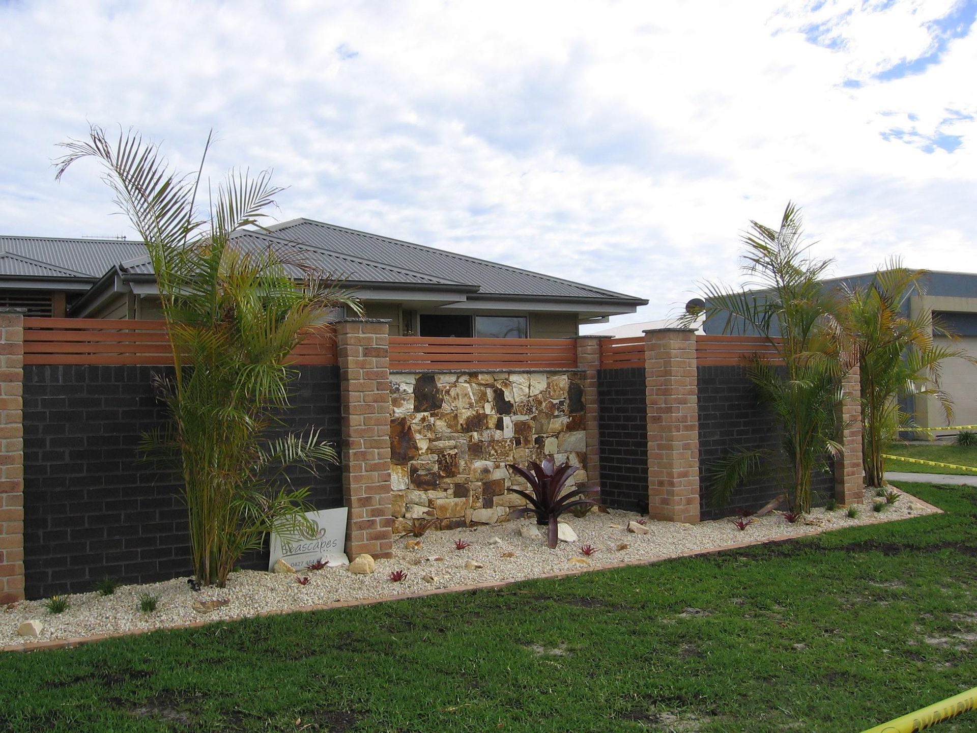 A House With a Stone Wall — Seascapes Landscape Construction in Kendall, NSW