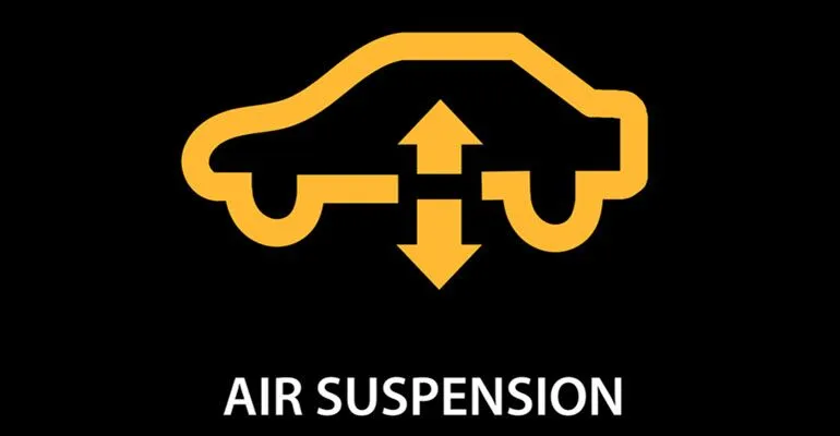 A yellow sign that says air suspension on a black background.