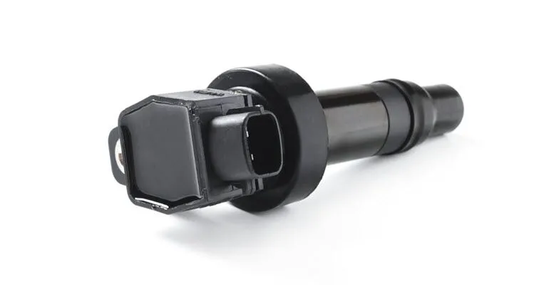 A close up of an ignition coil on a white background.