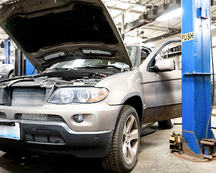 Vehicle with hood up in garage | Autohaus Service & Sales