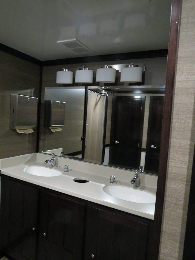 Trailer bathroom with wide mirror