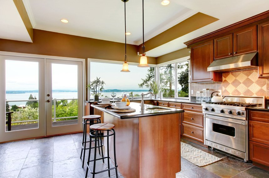 A kitchen with stainless steel appliances and wooden cabinets