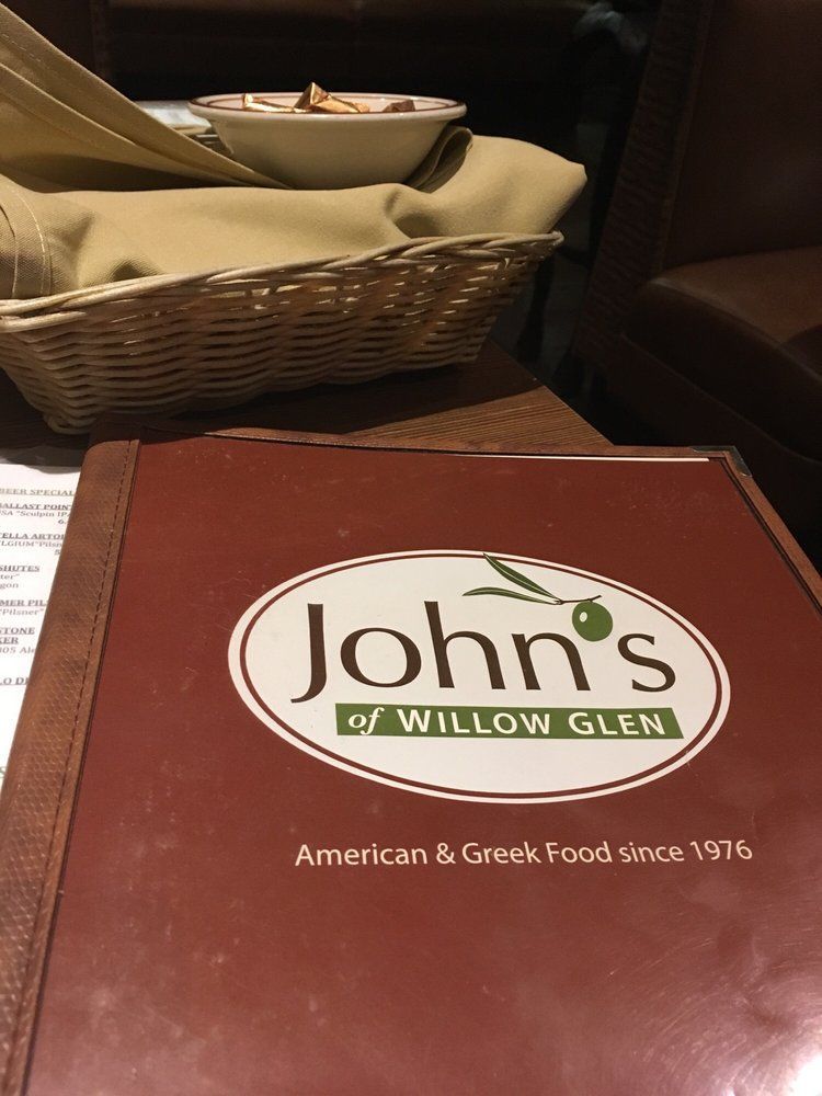 A menu for john 's of willow glen sits on a table