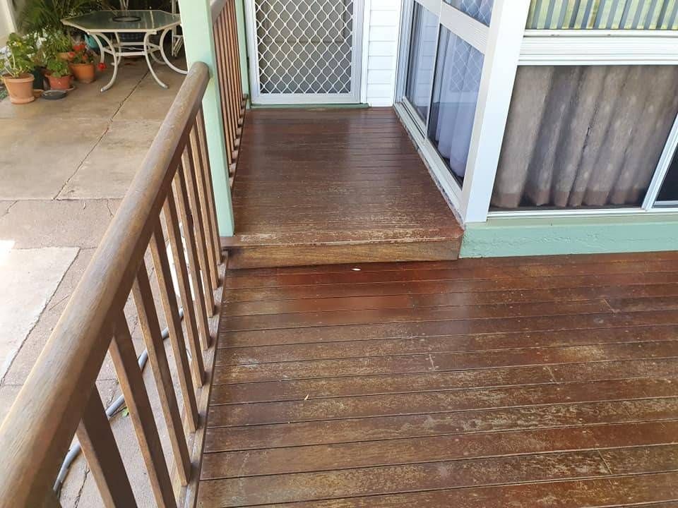 A Wooden Deck with A Railing and Stairs Leading to A Window — Finish It Floor Sanding in Gayndah, QLD