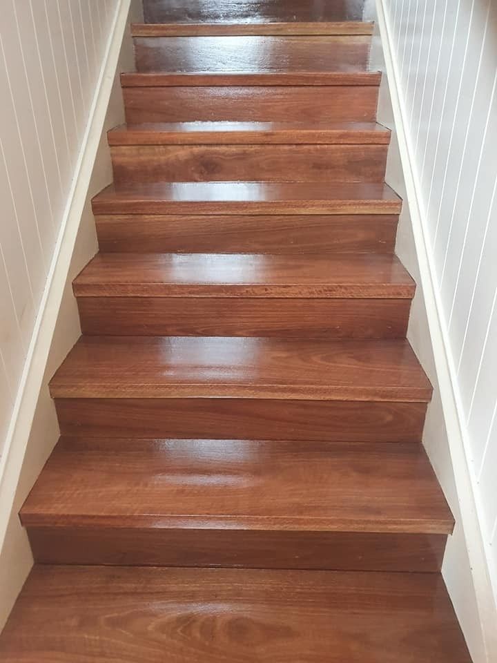 A Set of Wooden Stairs Leading up To a White Wall — Finish It Floor Sanding in Bucca, QLD