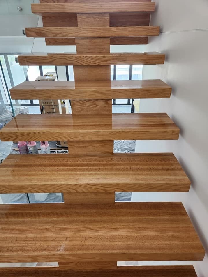 A Close up Of a Wooden Staircase in A House — Finish It Floor Sanding in Bucca, QLD