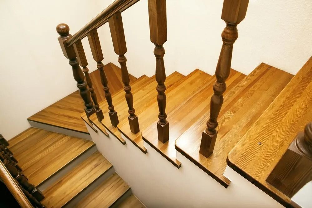 A Set of Wooden Stairs with A Wooden Railing — Finish It Floor Sanding in Bundaberg, QLD