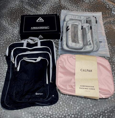 packing cube options on gray bedspread black gonex packing cubes pink calpak packing cubes gray monos packing cubes black well traveled box containing packing cubes