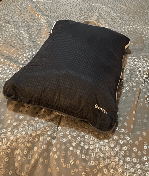 gonex black packing cube on gray bedspread gray zipper fully compressed packing cube
