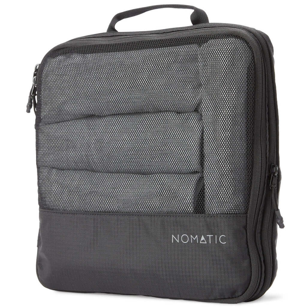 nomatic black packing cube grey nomatic logo grey clothes rolled in packing cube