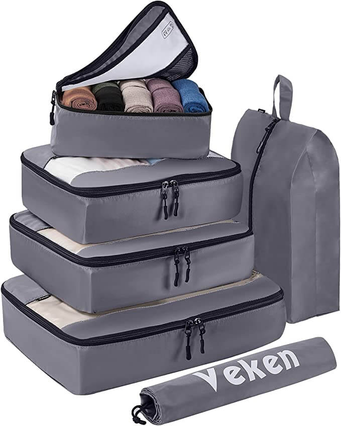 grey packing cubes stacked open top cube with clothes laundry bag shoe bag all grey with black zippers