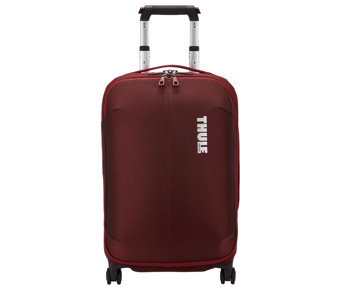 thule subterra carry on spinner suitcase red suitcase white thule text black and silver handle