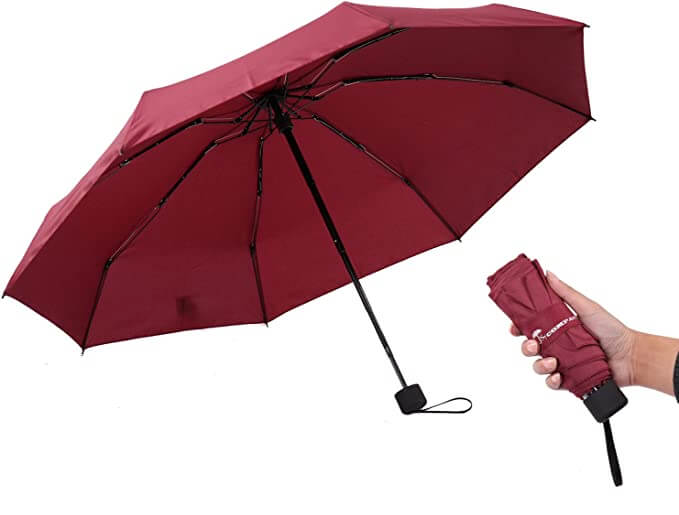 red umbrella open umbrella with black handle collapsed umbrella held in hand