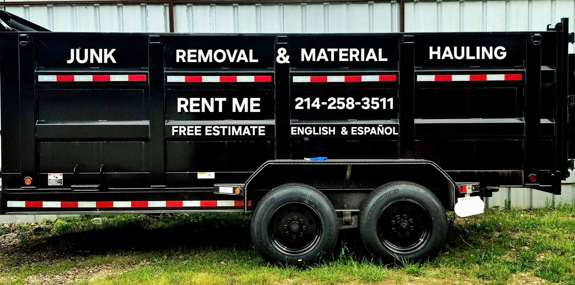 Black junk removal trailer with white text: 
