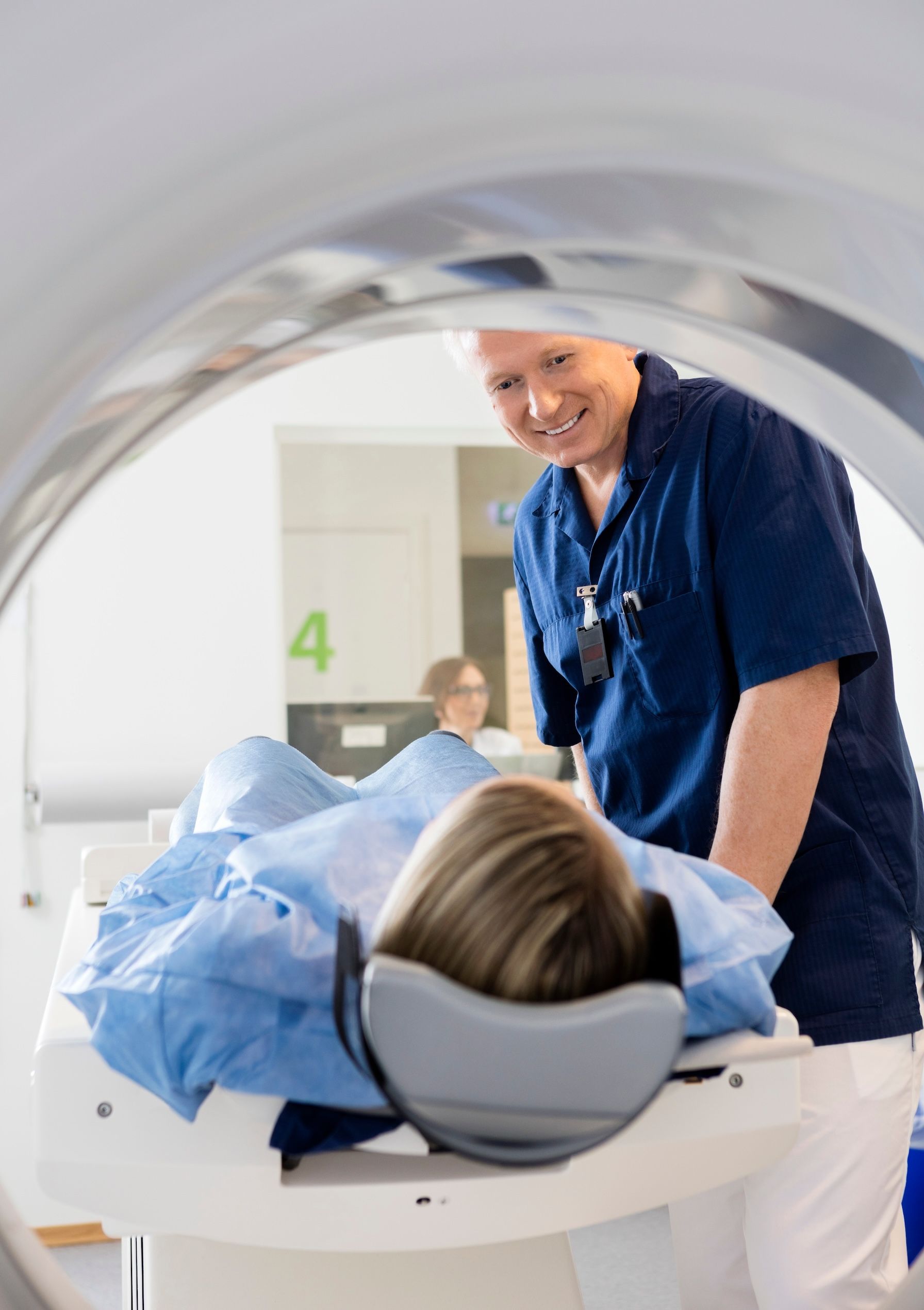 A woman is getting a facial treatment at a beauty salon.