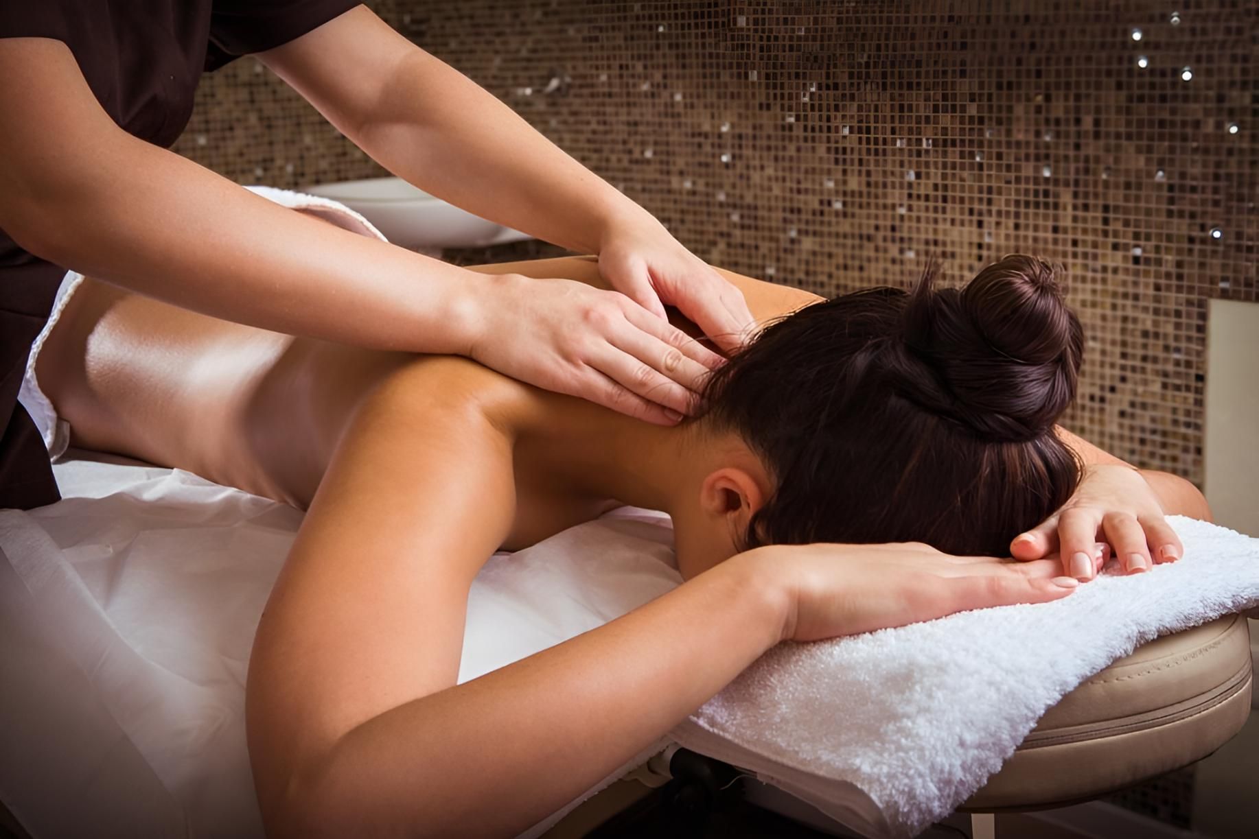Woman Having a Back Massage with a Flower in her Hair — Nonny Thai Healing Massage In Coffs Harbour, NSW