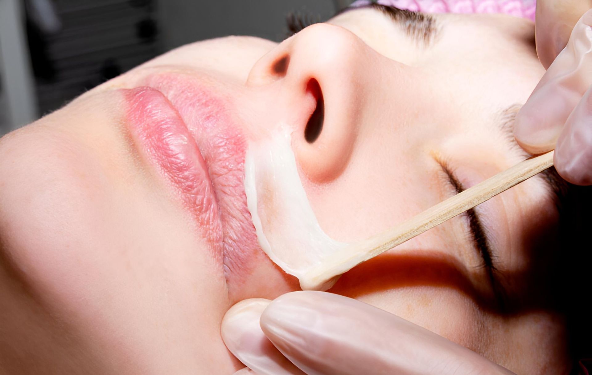 A Woman is Getting a Hair Removal Treatment on Her Face — Nonny Thai Healing Massage In Coffs Harbour, NSW
