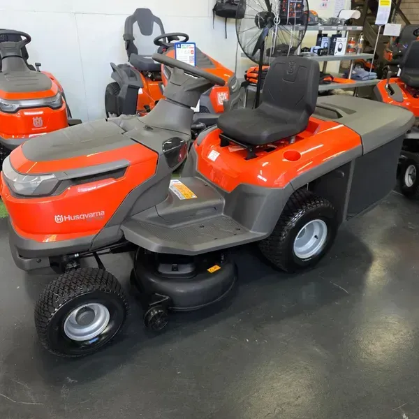 Orange and Gray Riding Lawn Mower Displayed Indoors — Lift It Equipment in Tuggerah, NSW