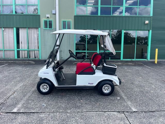 White Golf Cart With Red Seats Parked Outside a Building — Lift It Equipment in Central Coast Region, NSW
