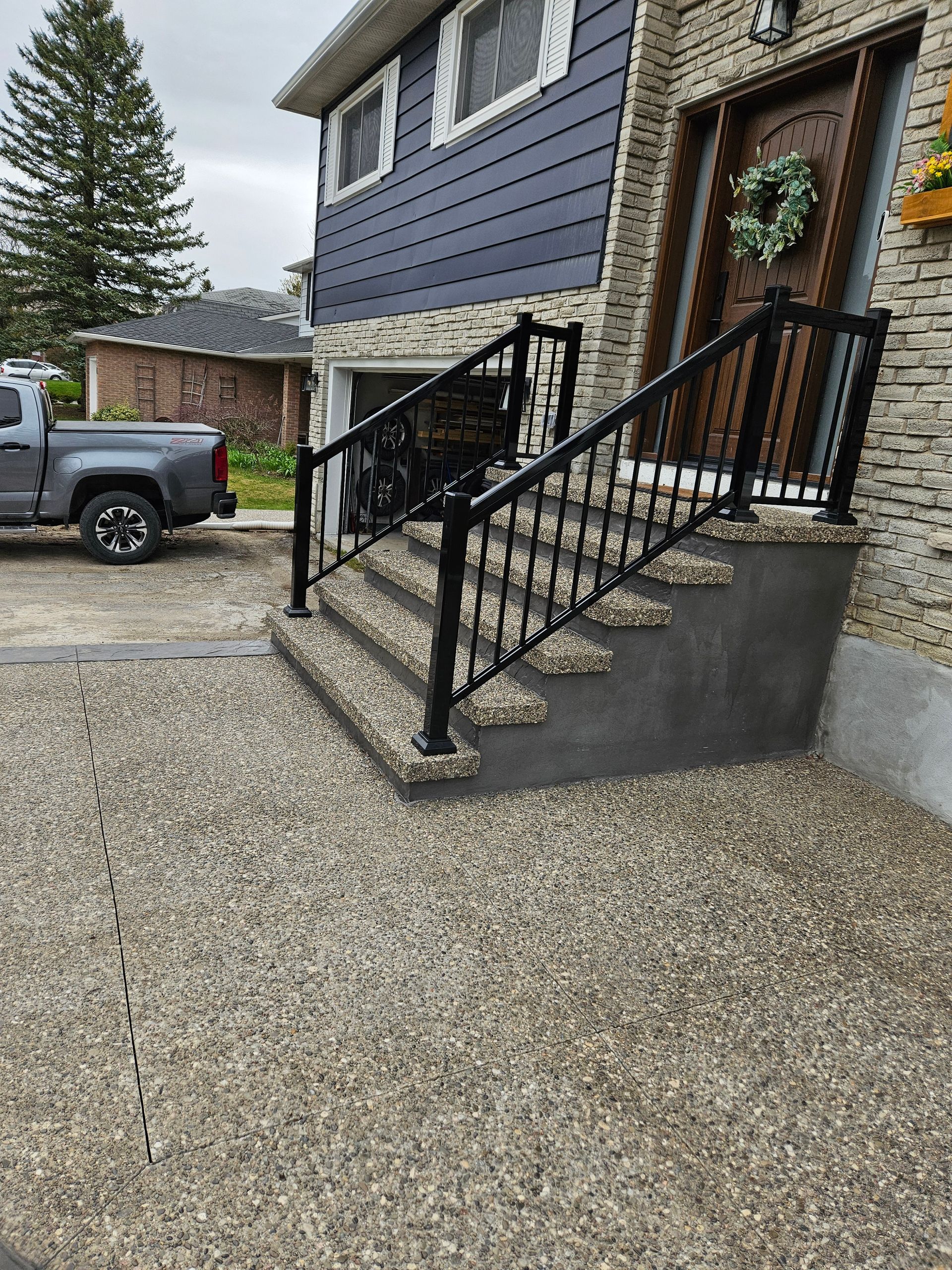 A set of stairs leading up to the front door of a house