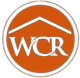 An orange circle with the word wcr in white letters